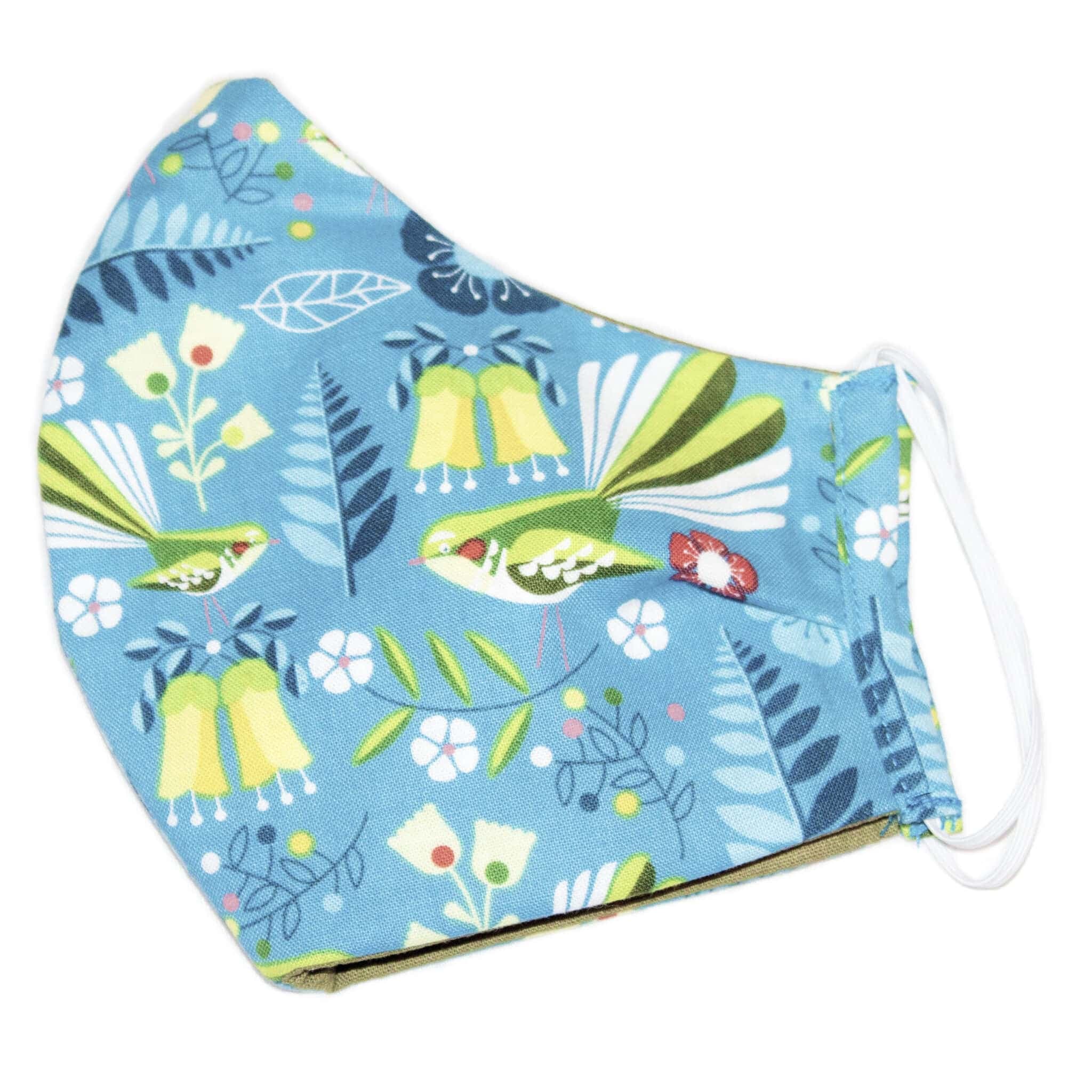 Display the Kiwiana Fantail Blue Face Mask lying on a table